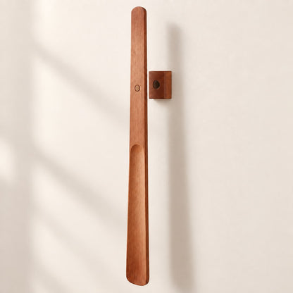 Brown wooden magnetic shoehorn with matching wall mount